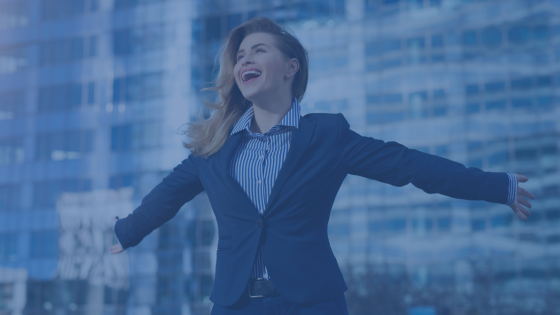 a female with arms spread wide and smiling is the image of leadership success