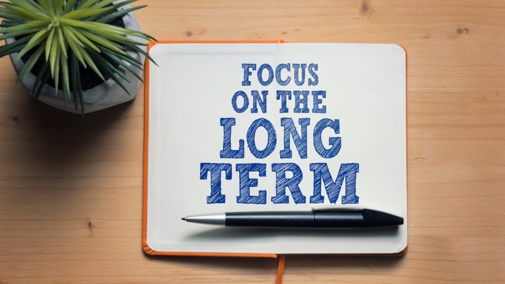 Sign with the words 'focus on the long term'