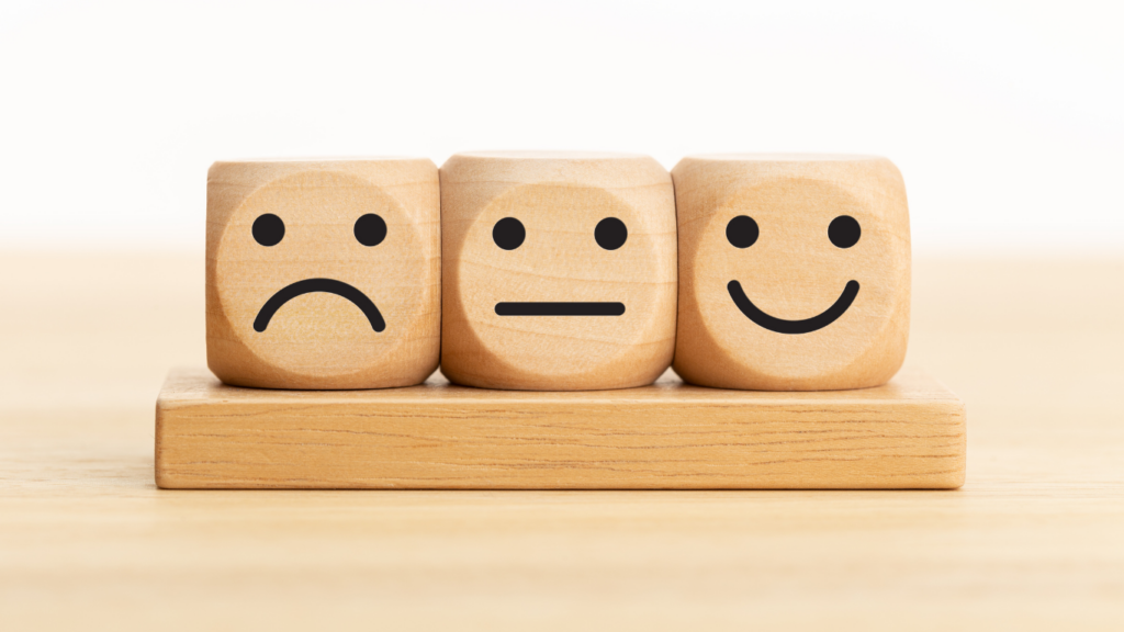 How hard is it to Maintain neutrality? Image of three expressions. Happy, sad and neutral